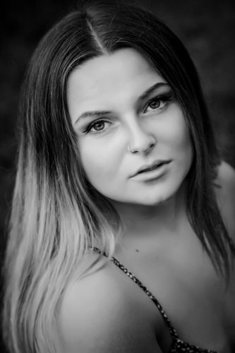 Black and white close up photo of high school senior girl